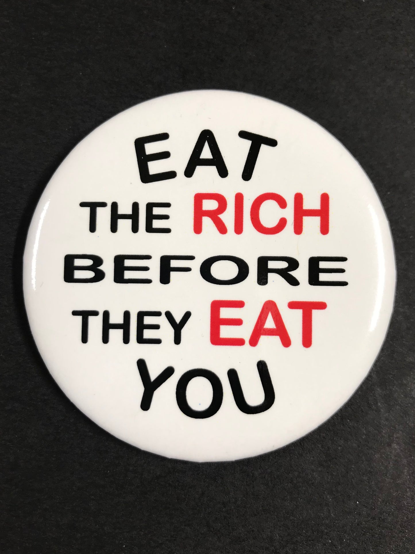 EAT THE RICH BUTTON